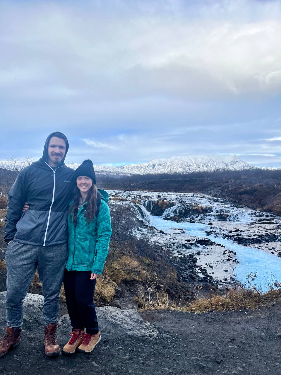 Christina and Benjamin in front of Icelandic waterfalls